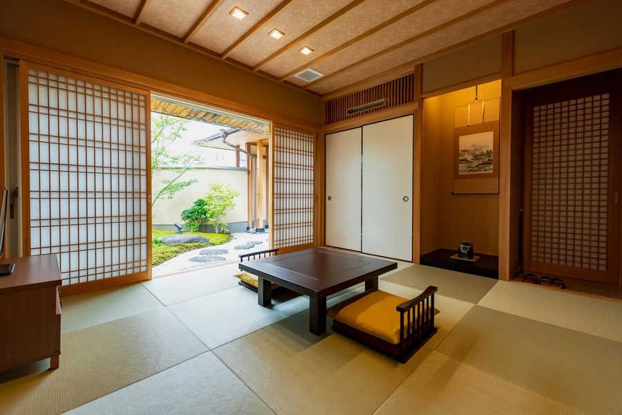Tatami room opening onto a small courtyard garden
