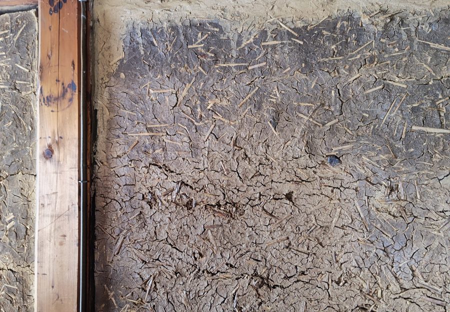 Aged earthen wall of an old house